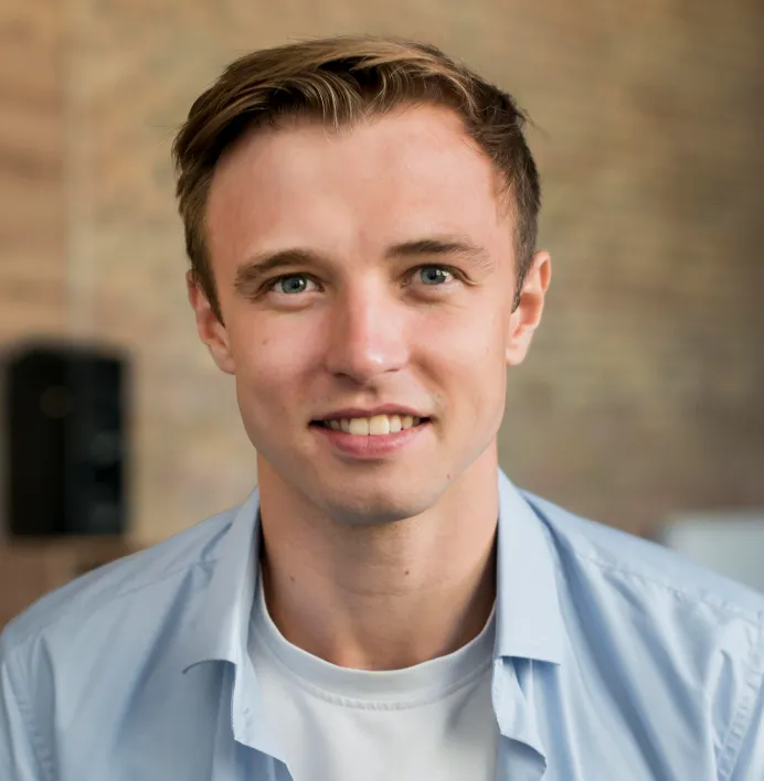 Young man with blue shirt.